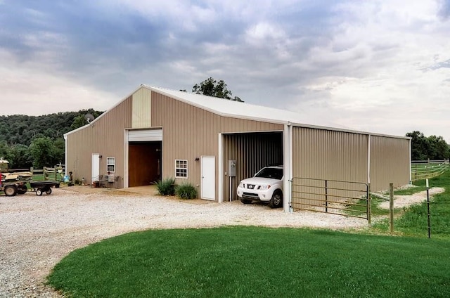 view of outbuilding featuring a yard