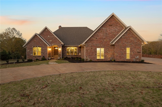 view of front of home with a yard