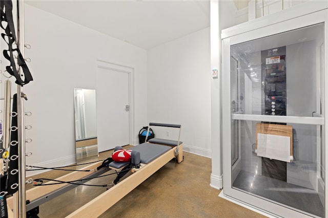 exercise room with concrete floors