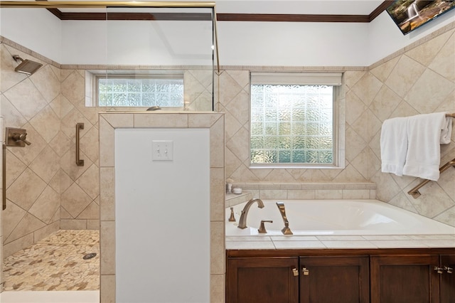 bathroom featuring separate shower and tub and ornamental molding