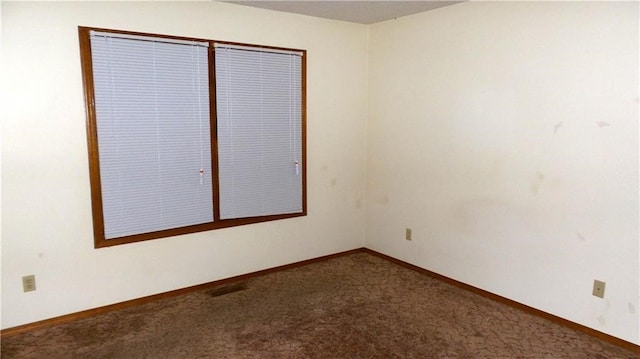 spare room featuring carpet floors