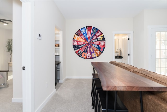 dining area with light colored carpet