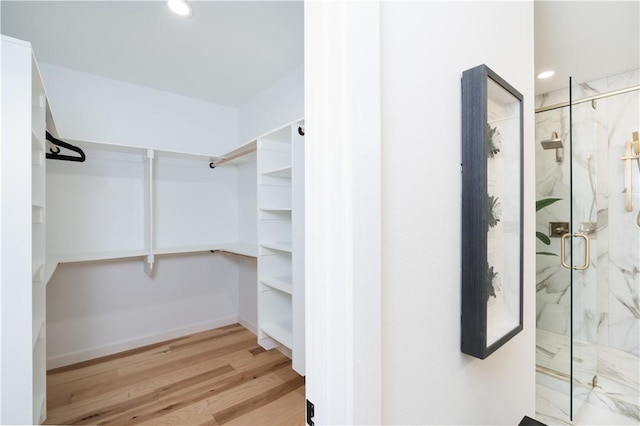 1433 S Duncan Ave, Fayetteville, AR 72701 - walk in closet featuring wood finished floors