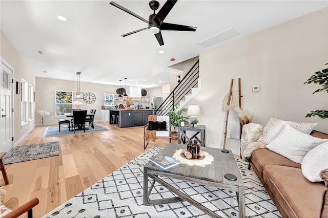 1433 S Duncan Ave, Fayetteville, AR 72701 - living area with stairs, a ceiling fan, light wood-style flooring, recessed lighting, and baseboards
