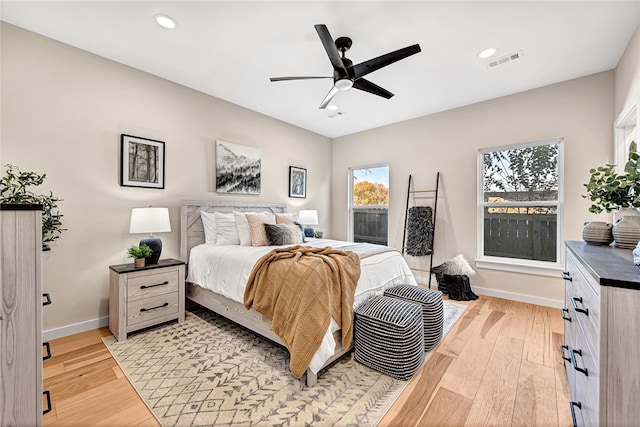 bedroom featuring ceiling fan and light hardwood / wood-style flooring