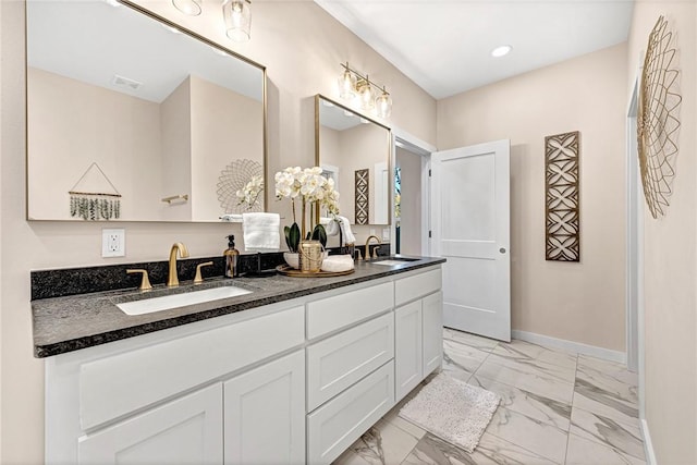 1433 S Duncan Ave, Fayetteville, AR 72701 - bathroom featuring marble look tiles, double vanity, baseboards, and recessed lighting