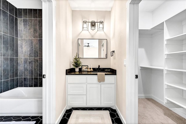 1433 S Duncan Ave, Fayetteville, AR 72701 - full bathroom with vanity, tile patterned floors, washtub / shower combination, and baseboards