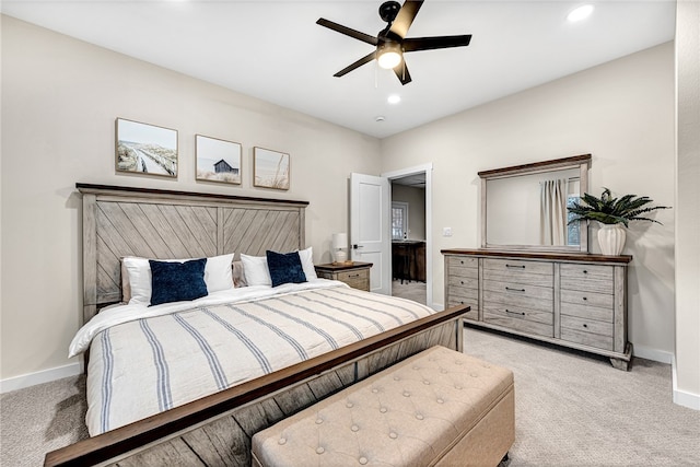 bedroom featuring light colored carpet and ceiling fan