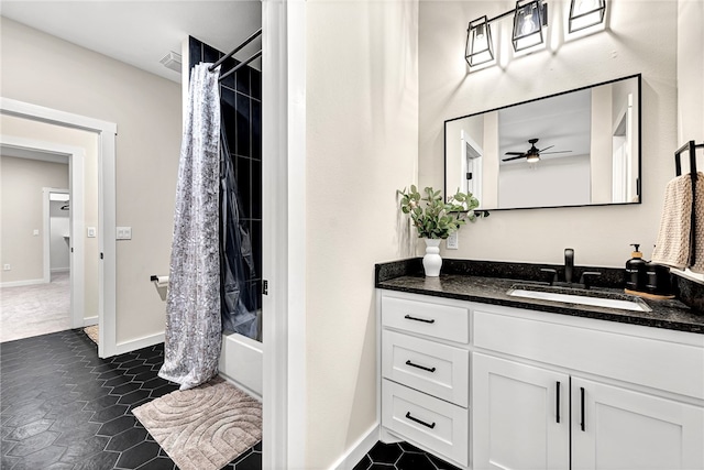 bathroom featuring vanity, shower / tub combo, and ceiling fan