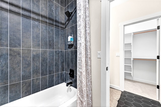 bathroom featuring tile patterned flooring and shower / tub combo