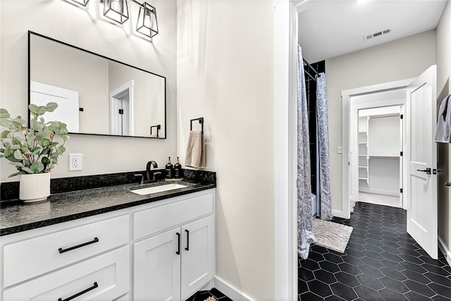 bathroom with vanity, a shower with curtain, and tile patterned floors