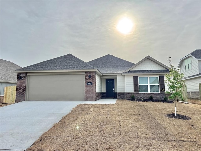 462 S Benchmark Ln, Fayetteville, AR 72704 - ranch-style house with brick siding, driveway, roof with shingles, and a garage