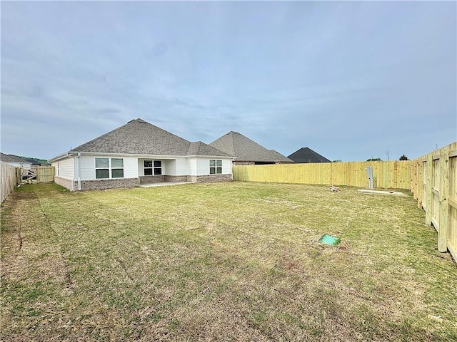 view of yard featuring a fenced backyard
