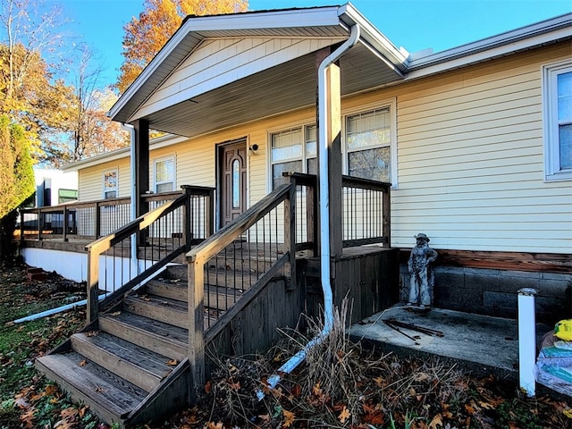 doorway to property with covered porch