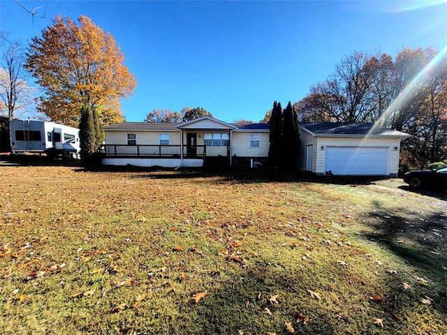 single story home with a front yard and a garage