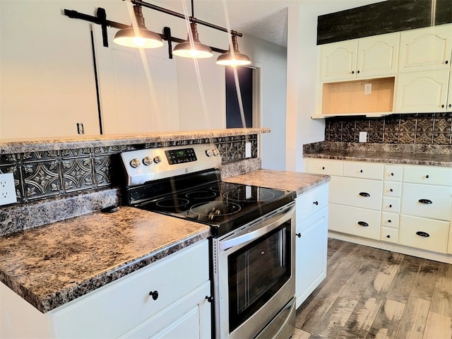 kitchen featuring white cabinets, decorative light fixtures, dark hardwood / wood-style flooring, and stainless steel range with electric cooktop