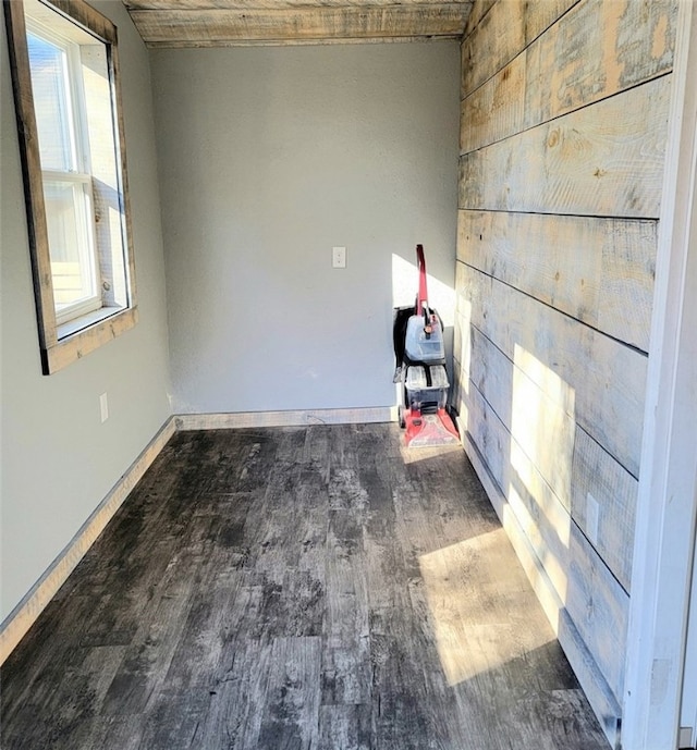 empty room with dark wood-type flooring