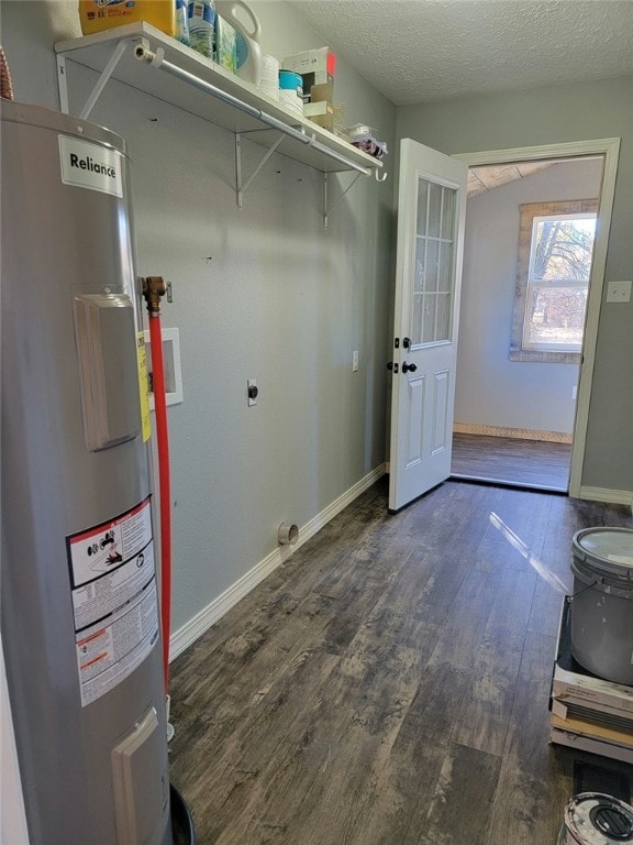 washroom featuring electric water heater, washer hookup, a textured ceiling, hookup for an electric dryer, and dark hardwood / wood-style flooring