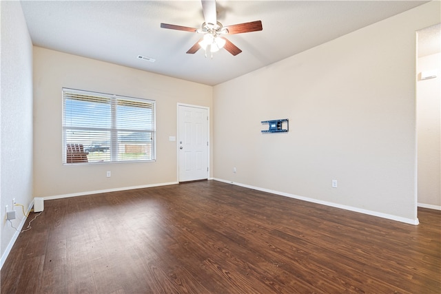 empty room featuring ceiling fan and dark hardwood / wood-style flooring