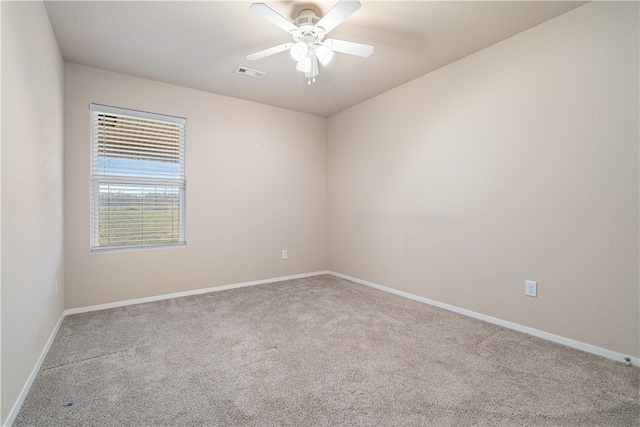 carpeted empty room with ceiling fan