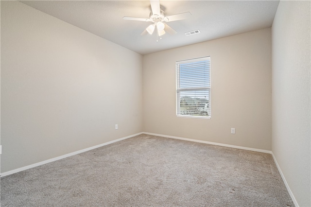 unfurnished room with carpet and ceiling fan