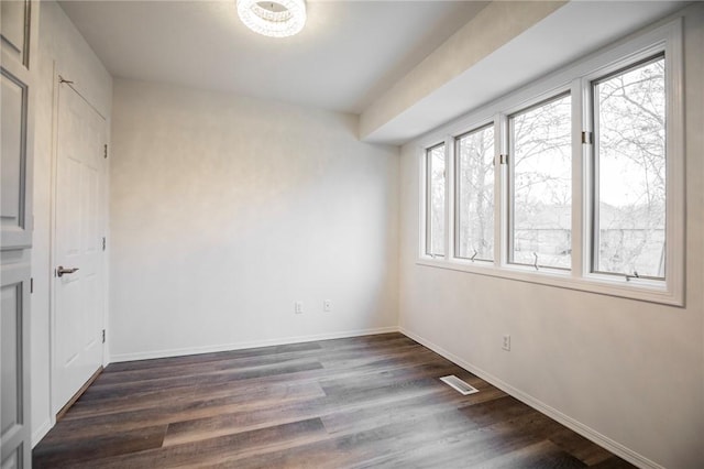 unfurnished bedroom featuring dark wood-type flooring