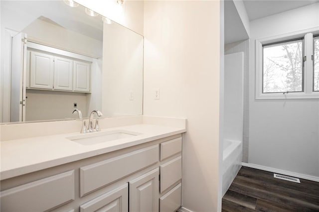 bathroom featuring hardwood / wood-style floors and vanity