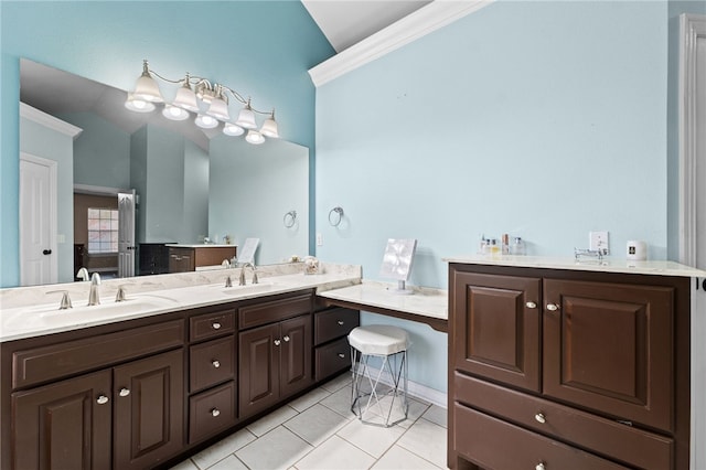 bathroom with vanity, tile patterned floors, vaulted ceiling, and crown molding