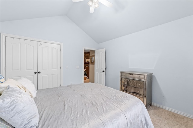 carpeted bedroom with a closet, ceiling fan, and lofted ceiling