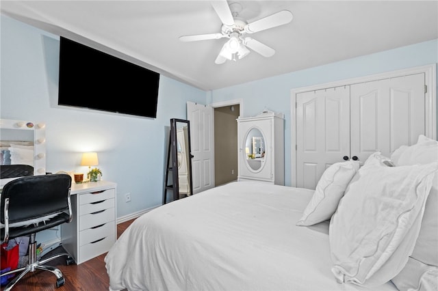 bedroom with ceiling fan, dark hardwood / wood-style flooring, and a closet