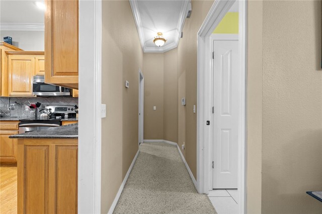 hallway featuring ornamental molding