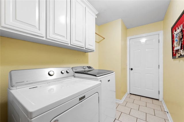 laundry area with cabinets and separate washer and dryer