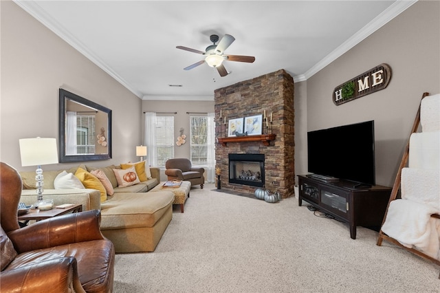 carpeted living room featuring a stone fireplace, ceiling fan, and ornamental molding