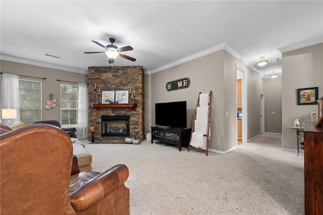 living room featuring a fireplace, ceiling fan, carpet floors, and crown molding