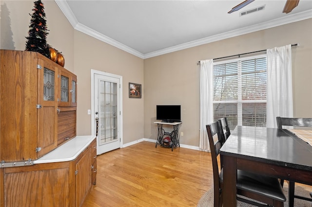 home office featuring light hardwood / wood-style flooring and ornamental molding