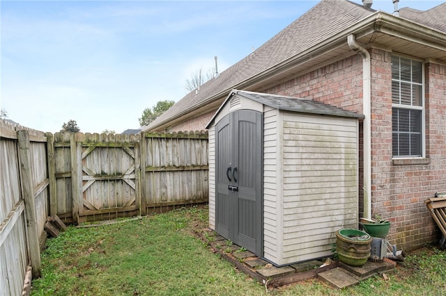 view of outbuilding featuring a yard