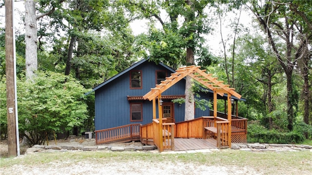 view of front of home featuring a wooden deck