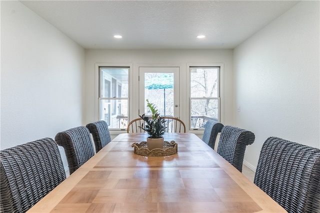 dining space featuring a textured ceiling