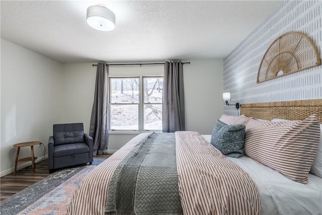 bedroom featuring hardwood / wood-style flooring and a textured ceiling