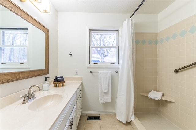 bathroom featuring tile patterned floors, vanity, and a shower with shower curtain