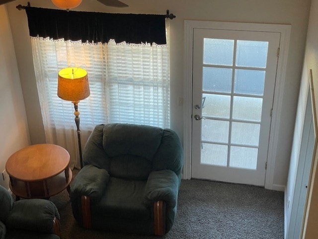 sitting room featuring carpet flooring and ceiling fan