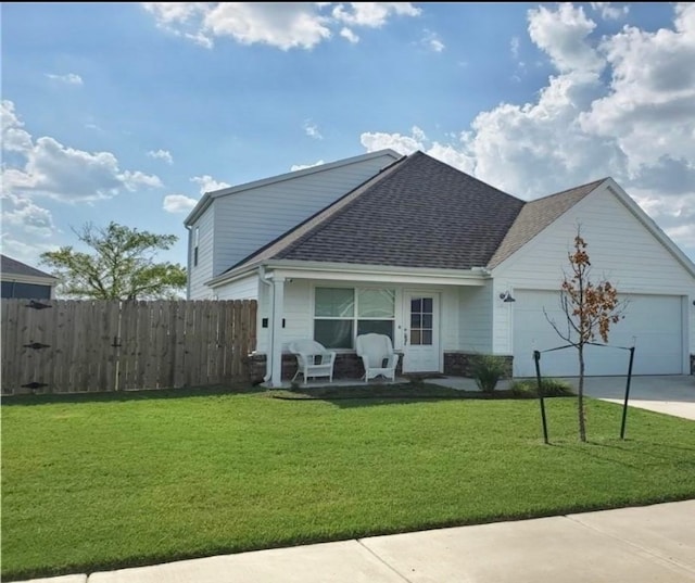 view of front of property with a garage and a front yard