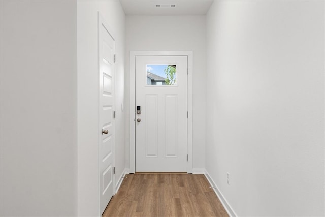 doorway to outside featuring light hardwood / wood-style floors