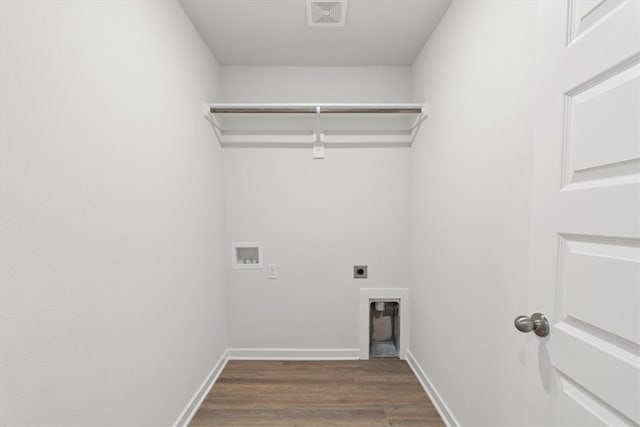 laundry room featuring hookup for a washing machine, dark hardwood / wood-style flooring, and electric dryer hookup