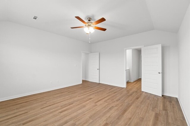 unfurnished bedroom featuring light wood-type flooring, ceiling fan, and lofted ceiling