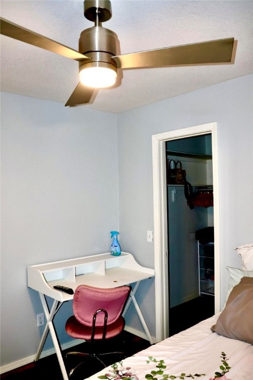 bedroom featuring ceiling fan and a closet