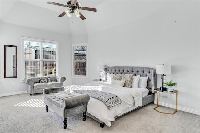 carpeted bedroom featuring ceiling fan and vaulted ceiling