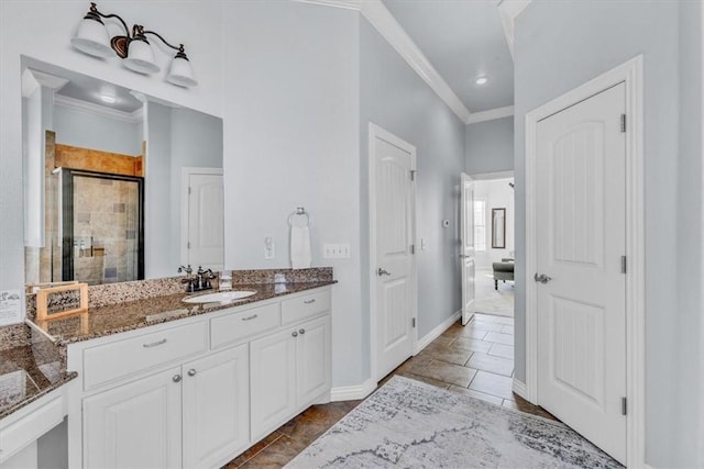 bathroom featuring crown molding, an enclosed shower, and vanity