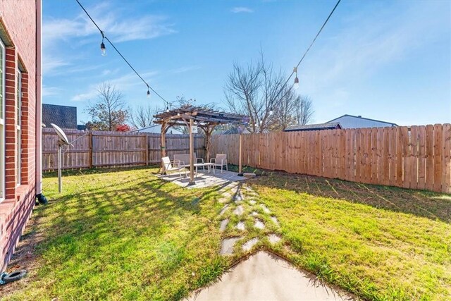 view of yard featuring a pergola and a patio area