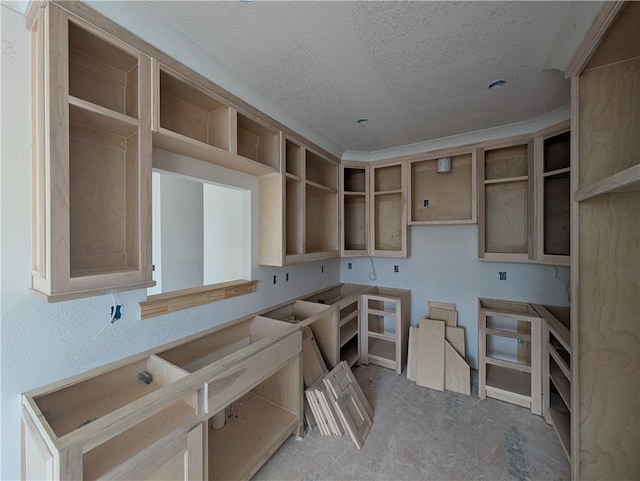 kitchen with a textured ceiling and open shelves